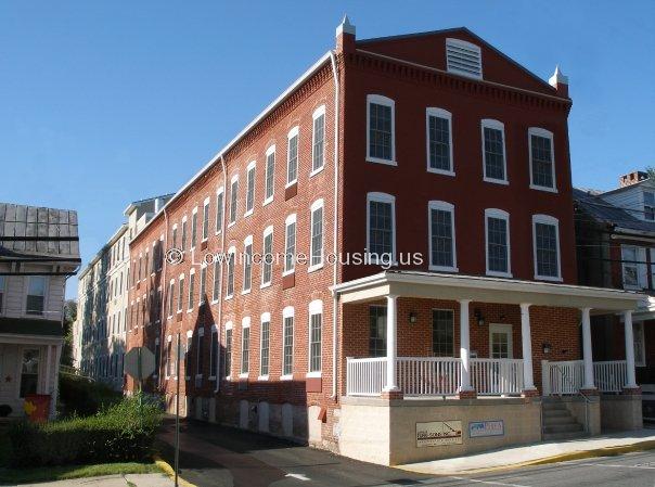 Classic red brick apartment building provide spacious living arrangements for single residents, couples and small families