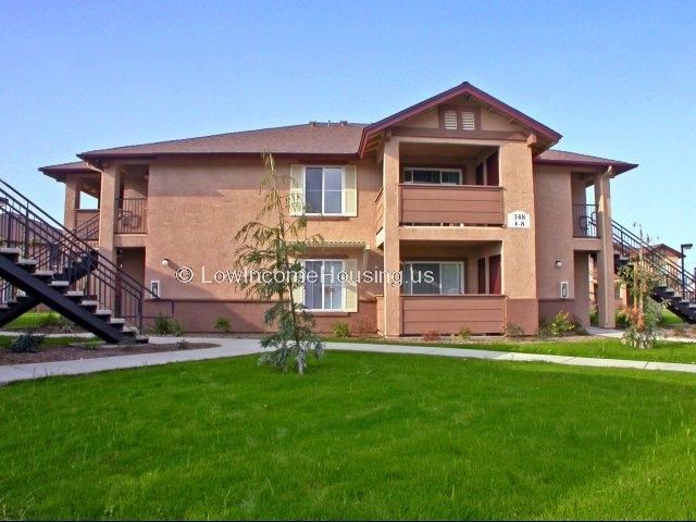Red brick country living with spacious, large 4 windows per unit and convenient on site parking. 