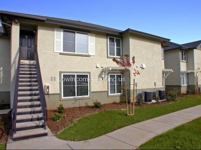 Row house apartments independent upper and lower living arrangement with large windows, built in air conditioning units and convenient on-site parking.