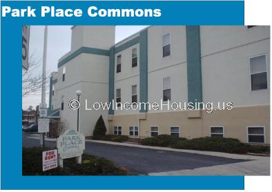 Park Place Commons with dormer windows and large, two story apartments with installed air conditioners