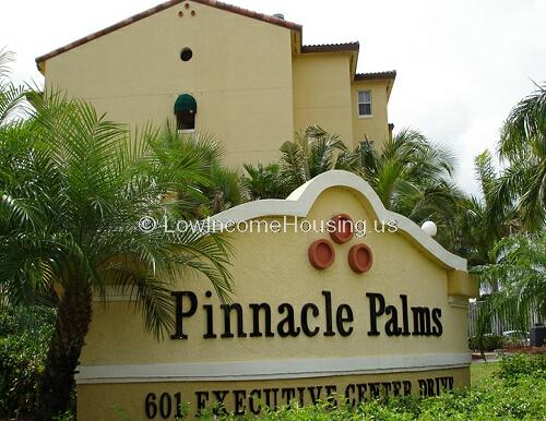 Pinnacle Palms Senior Living Facility.  Multi-storied living units with views to carefully landscaped pathways and luxurious foliage. 