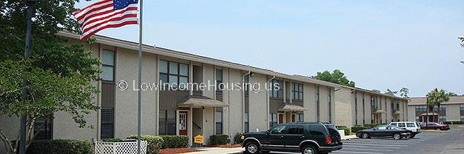 Row houses configured with five door way entrances with street level parking