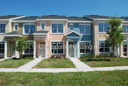 Classic row houses with tasteful color scheme provide elegant architectural design to single family units, large picture windows on first and second floors.