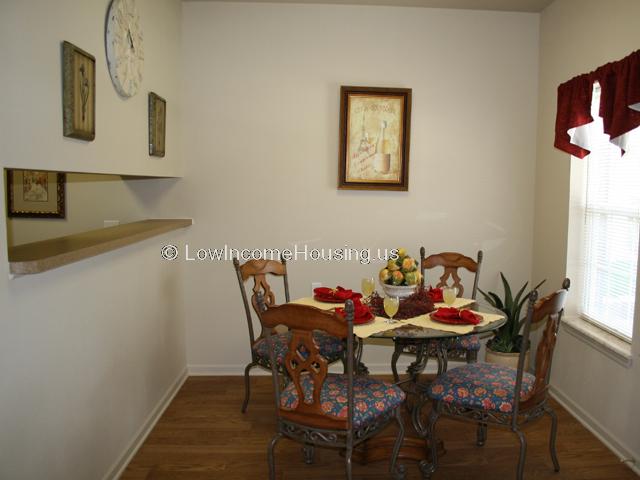 Apartment dining area is tastefully appointed with seating for guests.  