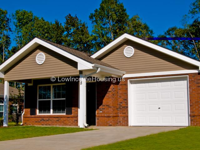 Classic red brick construction with full size garage door, Full size picture window.