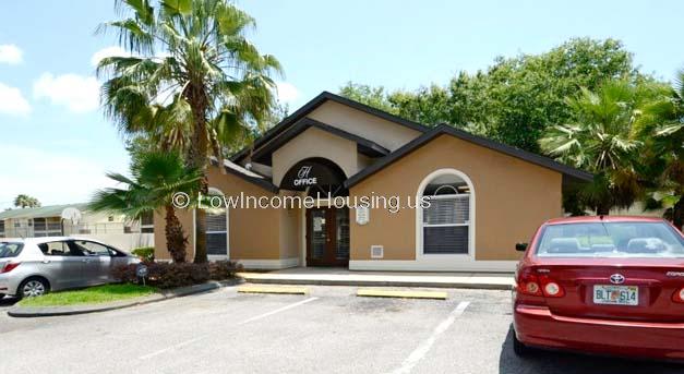 Classic red brick construction for administrative functions (office) with street level parking.  The building includes large windows that permit natural sunlight illumination.  