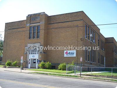 Large red brick office building.  There is no sign of construction activity at the location.  