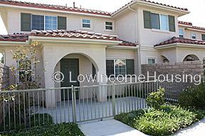 Classic archways, large window units, two story structure, wrought iron fencing, tasteful architectural details