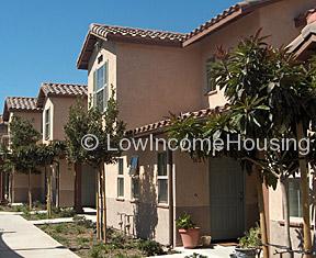 classic red brick urban housing with ample window space, large second floor picture windows