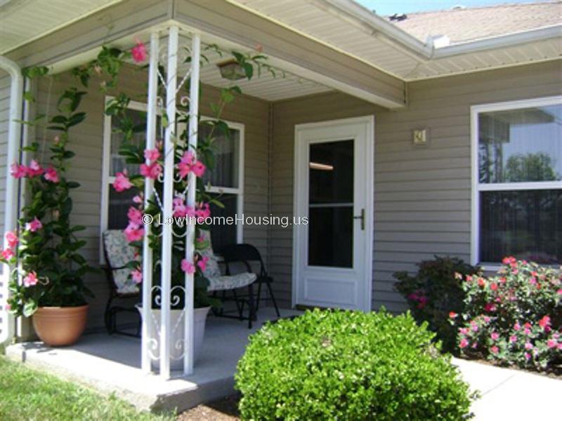 Tastefully appointed entrance  with seasonal flowers, and comfortable seating.