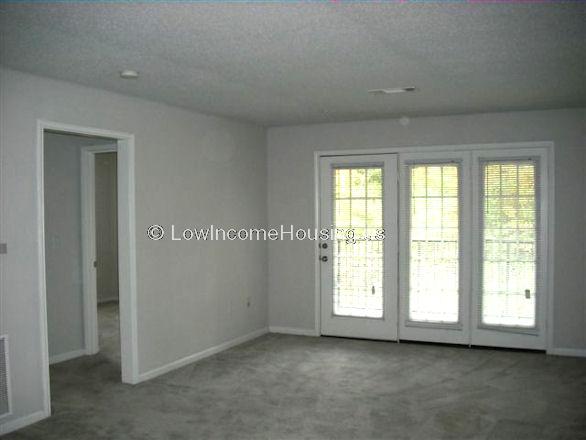 Large, dining area with access to exterior patio via double doors.