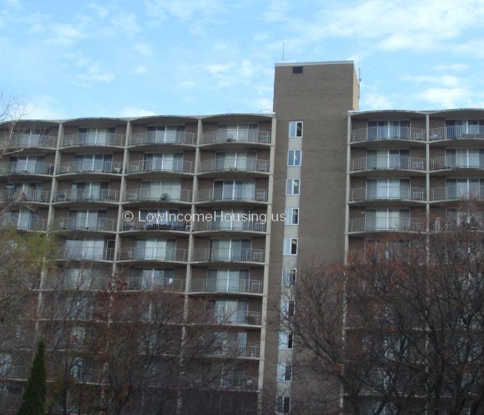 Large apartment building with elevator access to all floors.   Each apartment is equipped with wrought iron fencing and a large sliding door into the apartment. 