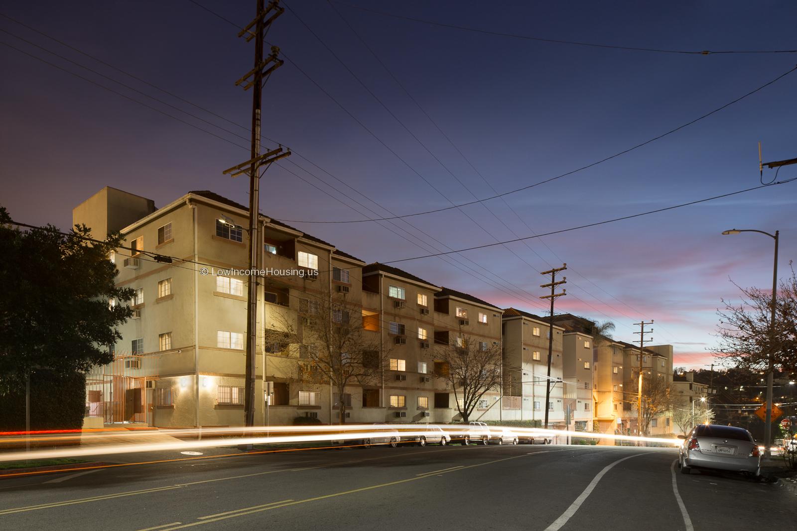 Classic four story urban housing  with large picture windows and open balconies