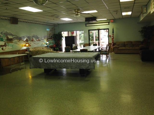 Photograph of large foyer equipped with various tables and chairs.  