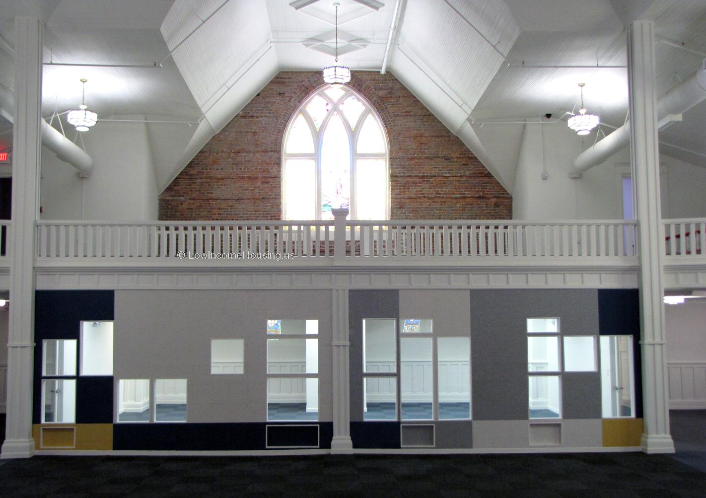 On the lower level the photograph shows a hall way which could be used for transaction processing. The upper level could be used for work in process. 
