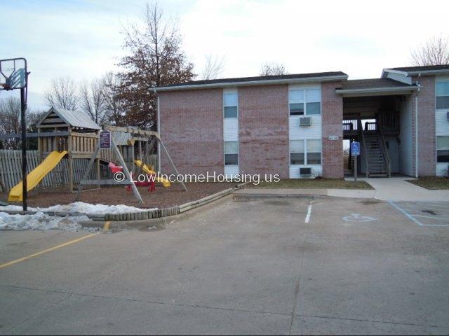 Classic red brick construction includes air conditioning units installed and functioning.  Housing units include exterior stair well the provide privacy and security to living units. 