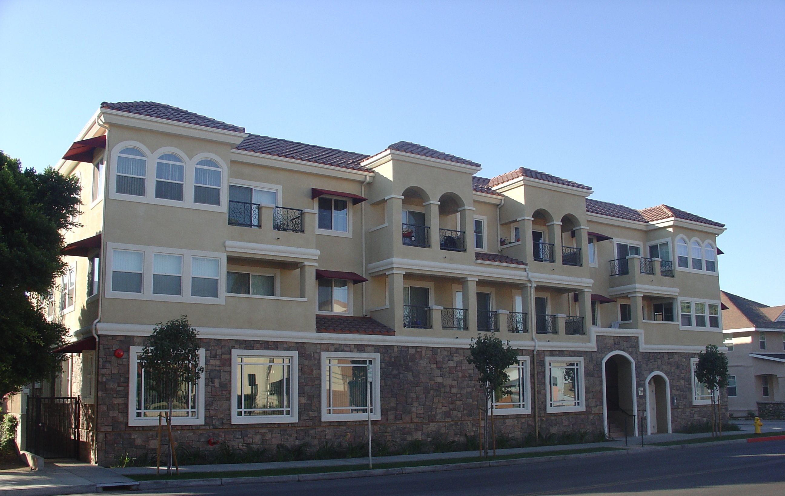 fabulous, large glass windows Second story balconies  with wrought iron balconies and exterior siting spaces.