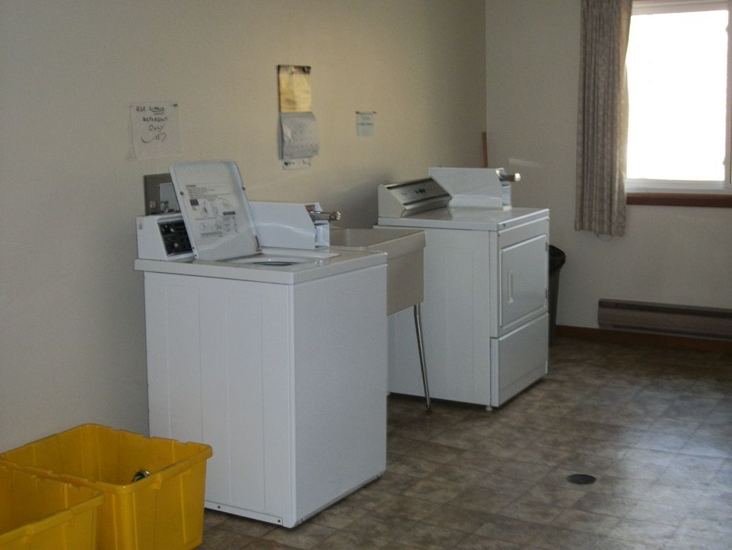 Large capacity, coin operated, washer/dryer equipped with sorting and folding  table