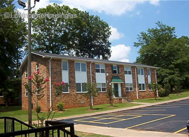 Large red brick  construction housing 2 to 4 families