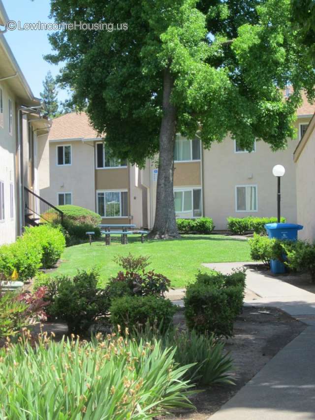 Large, spacious two story housing units with large windows, exterior picnic table, exterior lighting, mature shade trees and attractive setting. 