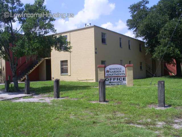 Seminole Garden Apartments - Two level yellow brick row house 