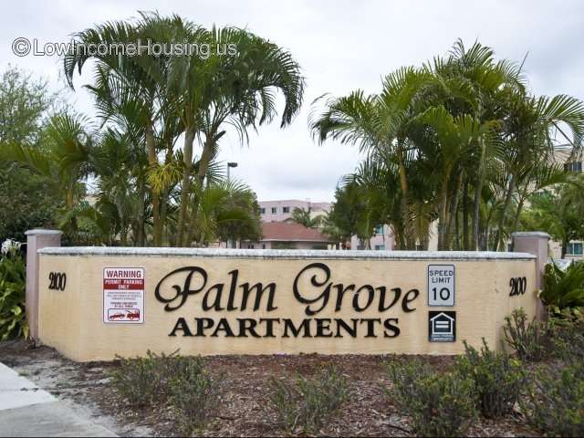 Entrance to Palm Grove Senior Living Apartments ample and spacious foliage