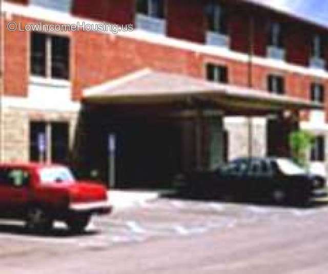 Photograph of large canopy structure providing shade over parking area.