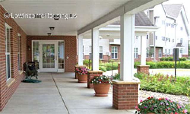 The photograph above shows the entrance to a hotel or motel where travelers could rent two or three rooms for the night.  Red brick is displayed as the most common building material.   