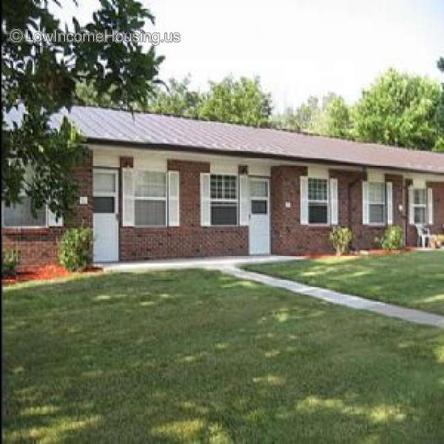 Classic Red Brick Row House Construction with large dormer windows