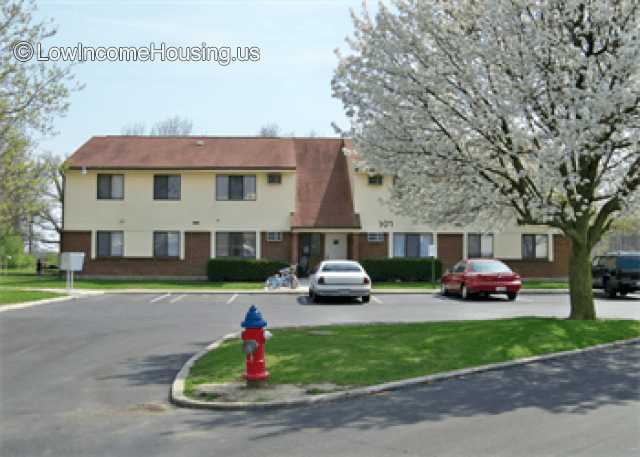 This photograph shows two houses of the same style and construction technique.