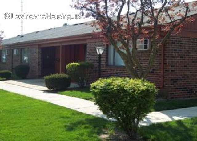 Simple wooden construction using red brick.  Roofing tile are held in place by nailers.