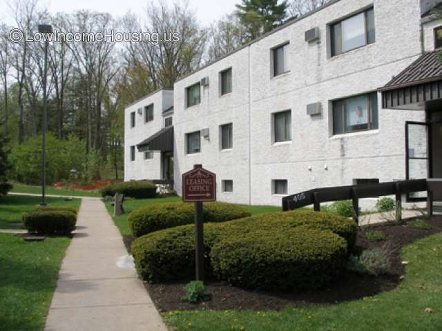 Classic white row house living units with air conditioning units installed.  Each unit has convenient curb side parking  available.  Grounds are carefully manicured 