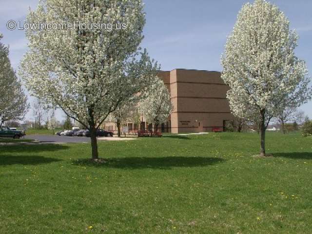 This is a photograph of a very large red brick building.  