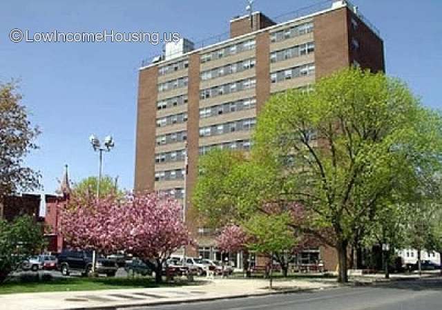 This is a photograph of a very large red brick building. 