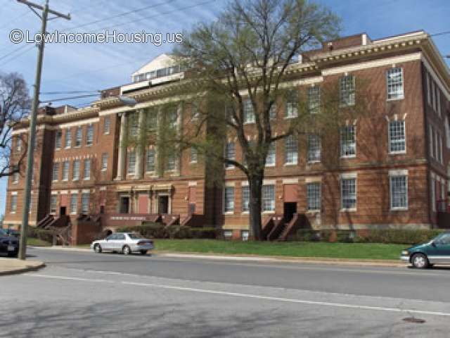 Imposing large apartment building housing 54 large apartments with convenient, on street parking.  