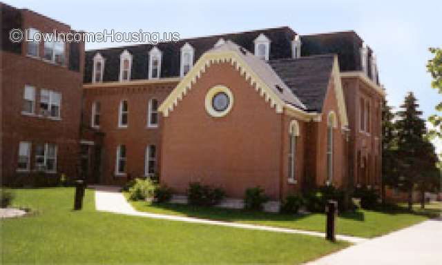 Saint Michael's brick structure with large enclosed space, three story building connecting, additional building connecting 