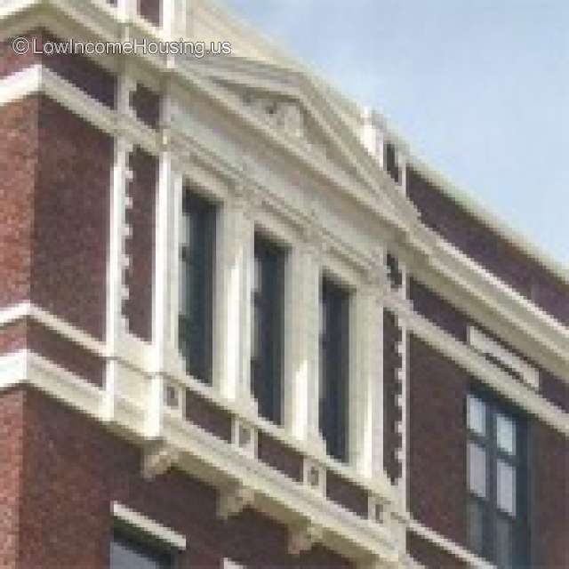 Closeup corner photo of Chippewa Falls Building with white Gothic  trim.