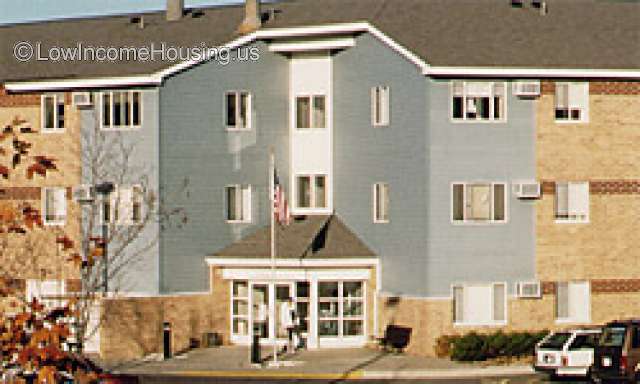 This is a photograph of Mount Carmel Manor.  It appears to be a three story brick structure. There is not further information available. 