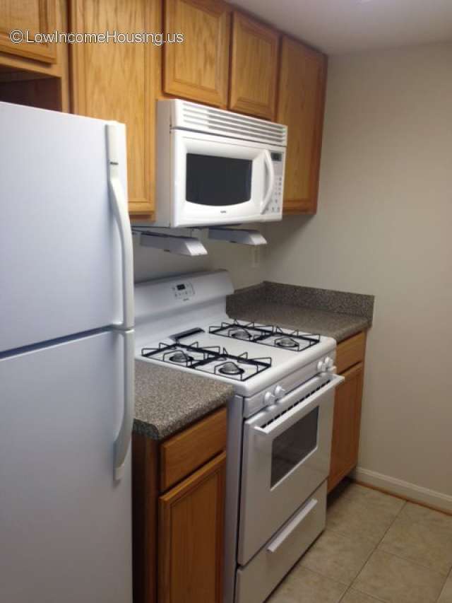 Frederick At Courthouse Apartments Arlington, VA Interior photo of kitchen unit in use.