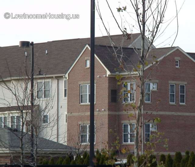 Photograph of two clapboard multi level structures - white and red clapboard construction. 