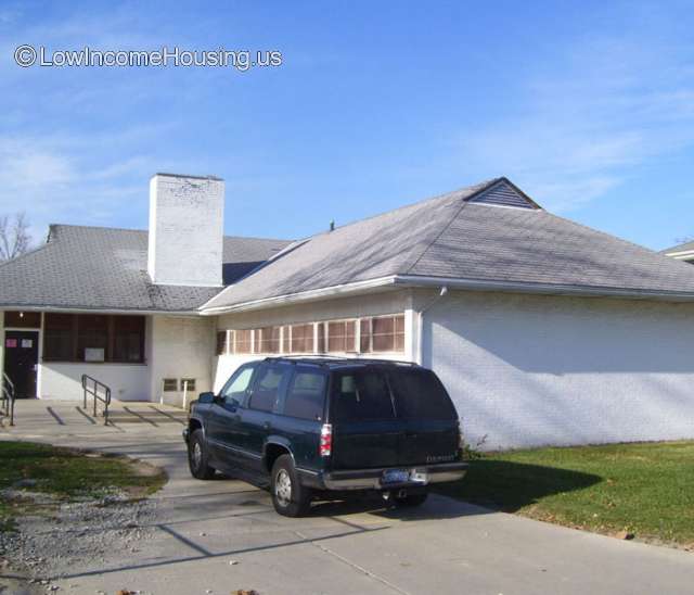 Photograph of dual unit with easy access to street and parking, fireplace in place.  