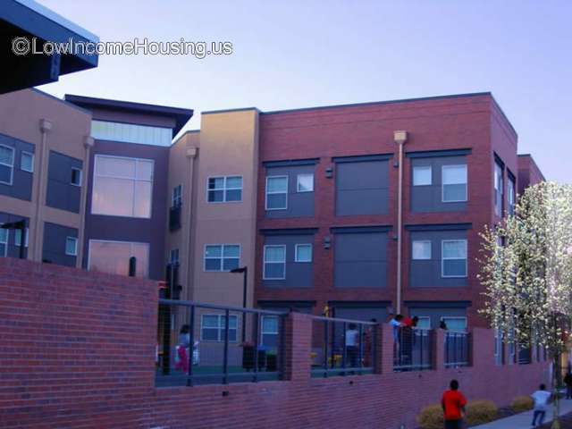 Large red brick four level construction with ample sized windows. 
