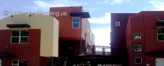 Three unit red brick construction units with pedestrian connections. 