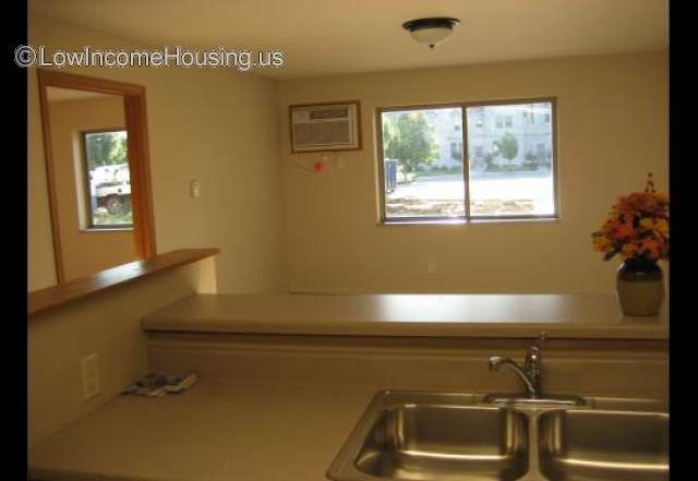 View from Kitchen into dinning area.  Twin sinks, access from kitchen area and dinning room.  Air conditioner installed. 
